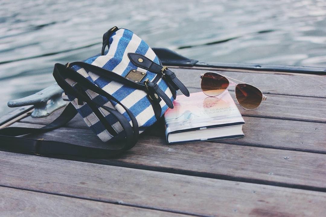 Summertime Essentials #cutebag  #sunglasses #greatbooks #allavailablewithyourlogo